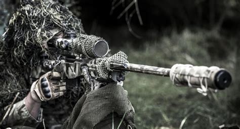Uk Army Sniper With 1rifles Battalion Takes Aim During An Excercise At