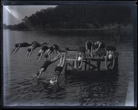 Women diving off pier at YWCA Camp Pawatinka – Maryland Center for