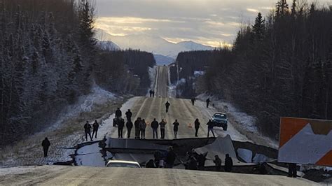 Tsunami sirens sound in kodiak, alaska after a major magnitude 8.2 earthquake struck off the coast; Alaska earthquake: Photos show damage to roads, businesses ...