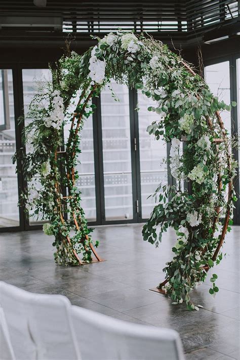 Lovely Greenery Adorned Circular Floral Wedding Arch Symbolically The Circle Lovely