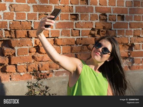 Woman Taking Self Image Photo Free Trial Bigstock