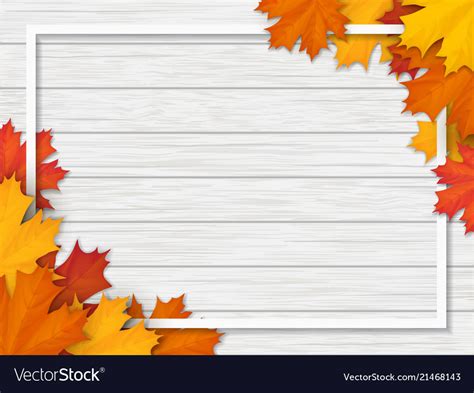 Autumn Leaves And Frame On White Wooden Background