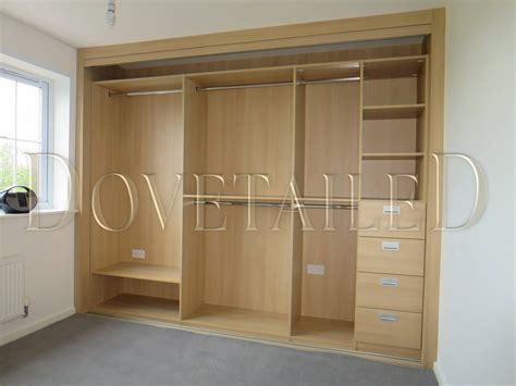 To fit the top and bottom tracks and insert the sliding doors, you will need to measure the space, cut the tracks to size, and. Fitted Wardrobes with Sliding Doors | Dovetailedinteriors ...