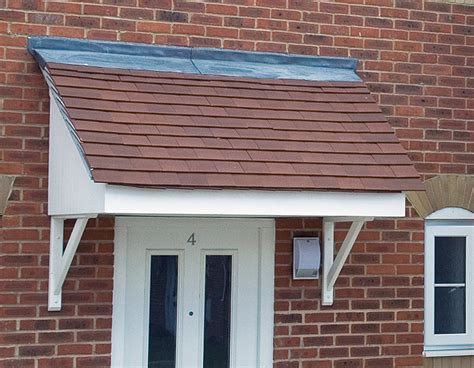 Fairy creature magic home with chimney on red roof. GRP Truss Rafter Canopies | Fibreglass Canopy