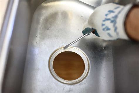 It will bubble and then you can scrub away with an unused toothbrush. How to Replace a Garbage Disposal in a Sink - TheDIYPlan