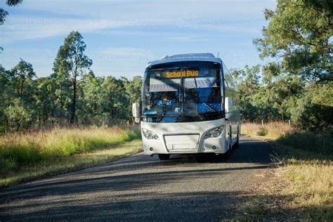 Image Of School Bus Driving Down Rural Country Road Austockphoto