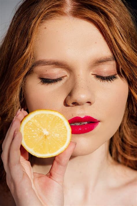 Beautiful Sensual Redhead Girl With Red Lips And Eyes Closed Posing