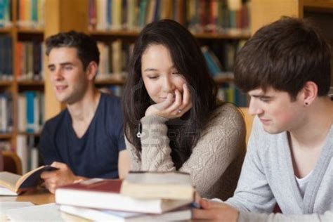 Students Studying Together In College Library Stock Photo 16056670