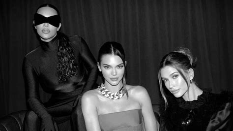 Kim Kardashian Shows Off Skinny Frame In Skin Tight Black Catsuit While Posing Next To Sister