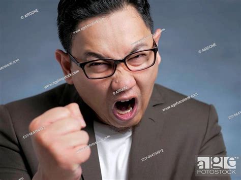 Angry Asian Businessman Showing His Fist Ready To Fight While