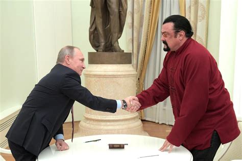 vladimir putin gives russian passport to steven seagal