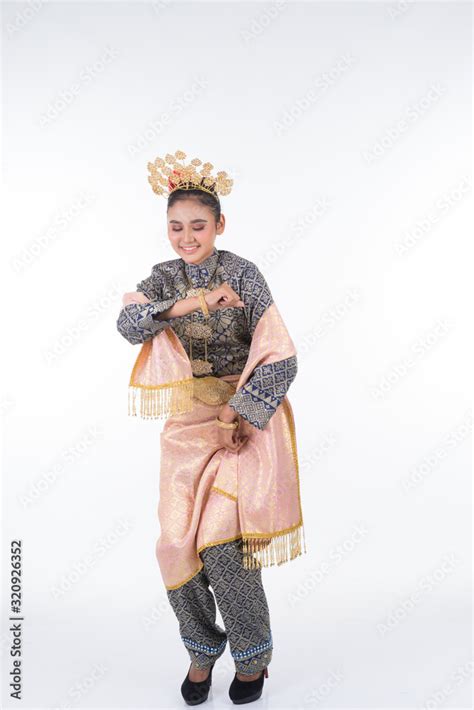 An Attractive Malaysian Traditional Female Dancer Performing A Cultural