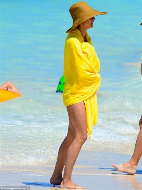 Heidi Klum Shows Off Her Perfect Bikini Body As She Chomps On French Fries On The Beach