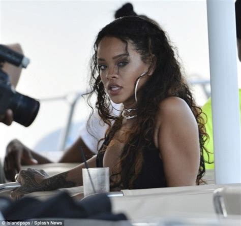 Rihanna Shows Off Her Flawless Figure In A Tiny Halter Neck Bikini