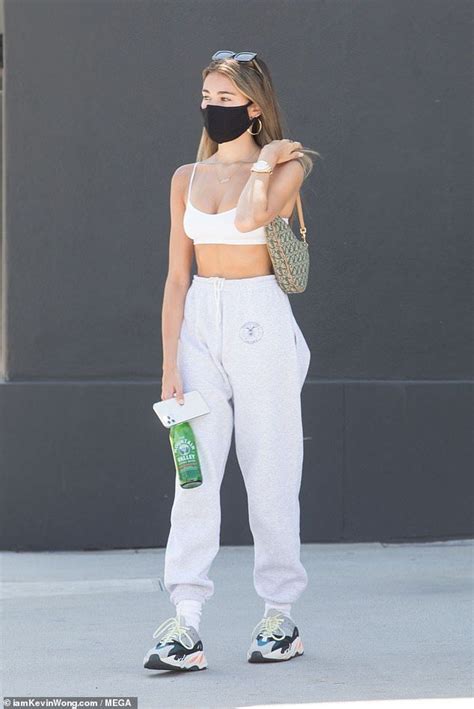 Madison Beer Displays Her Taut Waist In A Tiny Sports Bra As She Steps