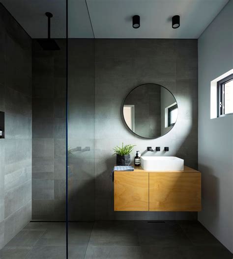 Boldly contemporary, dark grey or charcoal grey tiles give a modern touch to any environment. This modern master ensuite bathroom has dark grey tiled ...