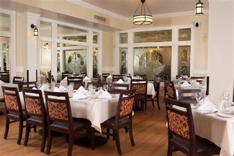 The classic white columns accent the yellow exterior, a vision that stands apart from the surrounding forest and meadows. Lake-Yellowstone-Hotel-Dining-Room-10
