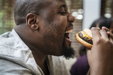 Free Man Eating A Big Hamburger Nohat Cc