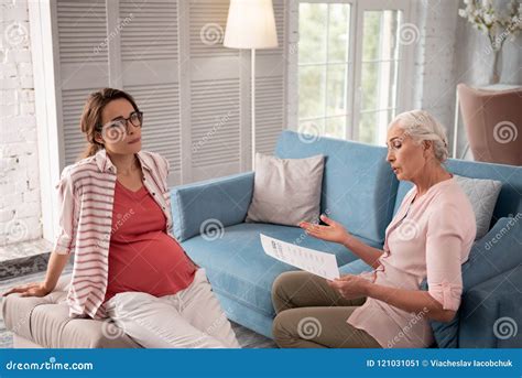 pregnant woman wearing glasses listening to private psychologist stock image image of
