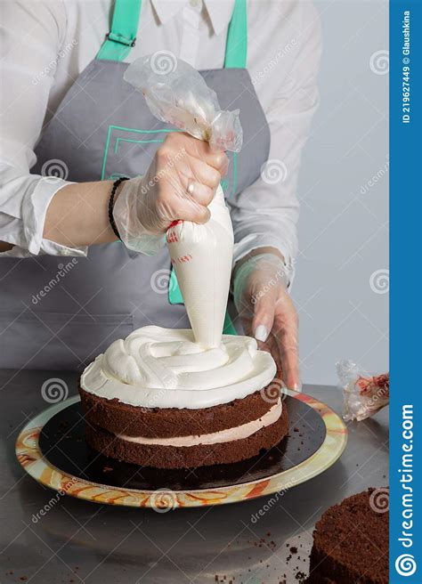 Woman Hands Chef Spreading Cream On Second Layer Of Chocolate Cake Stock Image Image Of