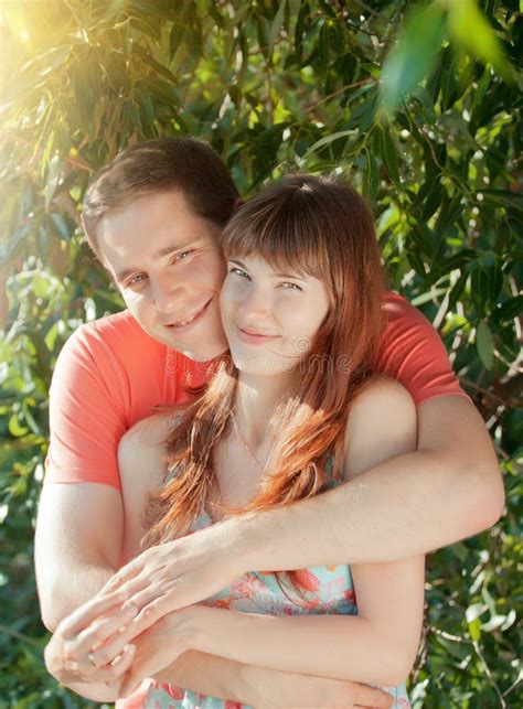 Beautiful Couple Of Lovers Relaxing In The Park Summertime Stock Image Image Of Male Grass