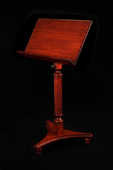 This is a small foldable wooden guitar stand that fits our living room. The Regency Wooden Music Stand