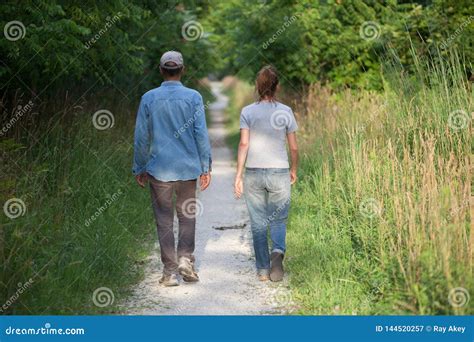 People Man Woman Unidentified Couple Walking Away Nature Trail Back