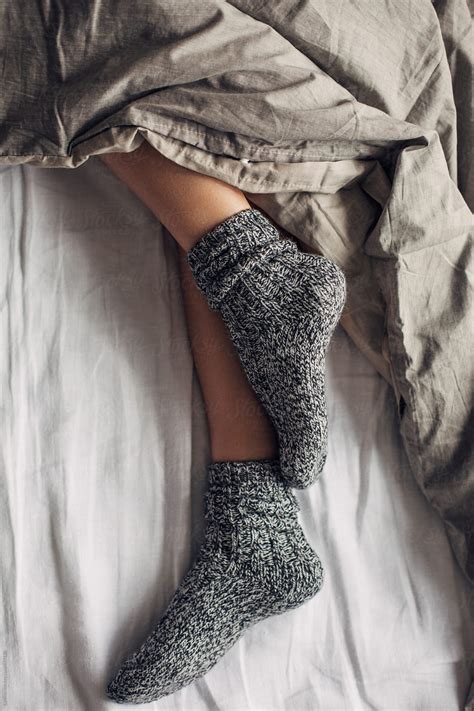 Woman Wearing Wool Socks Sleeping In Bed By Stocksy Contributor