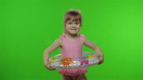 Funny Child Girl In Swimwear Walking With Swimming Ring Make Faces