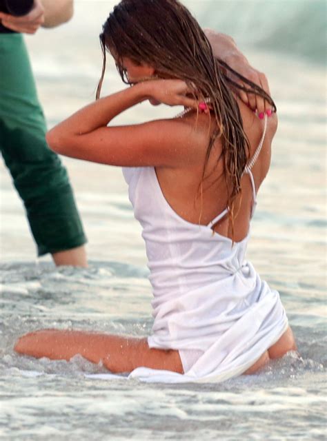 Nina Agdal Has A Couple Wardrobe Malfunctions While Navigating The Surf For A Photoshoot