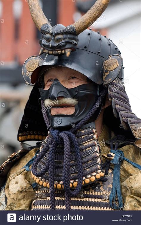 Man Dressed In Full Samurai Armor Complete With Kabuto Helmet And Mempo