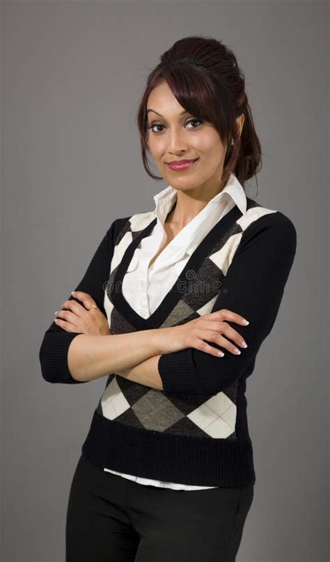 Confident Indian Businesswoman Standing With Arms Crossed Stock Image
