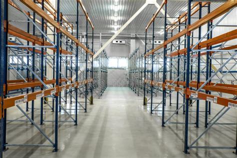 Empty Warehouse Shelves In Grey Industrial Interior Stock Photo Image