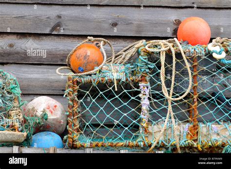 Some Old Lobster Pots Floats Buoys And Fishing Nets With Ropes Outside