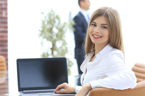 Rear Viewfemale Assistant Looking At The Camera Stock Photo Image