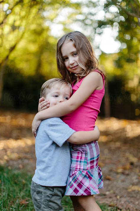 Big Sister Hugging Her Little Brother By Stocksy Contributor Jakob Lagerstedt Stocksy