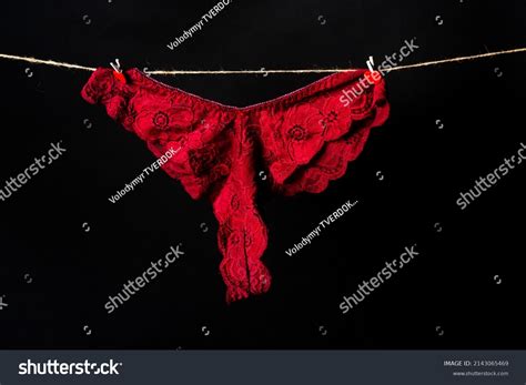 Womans Erotic Red Underwear Panties Hanging Stock Photo