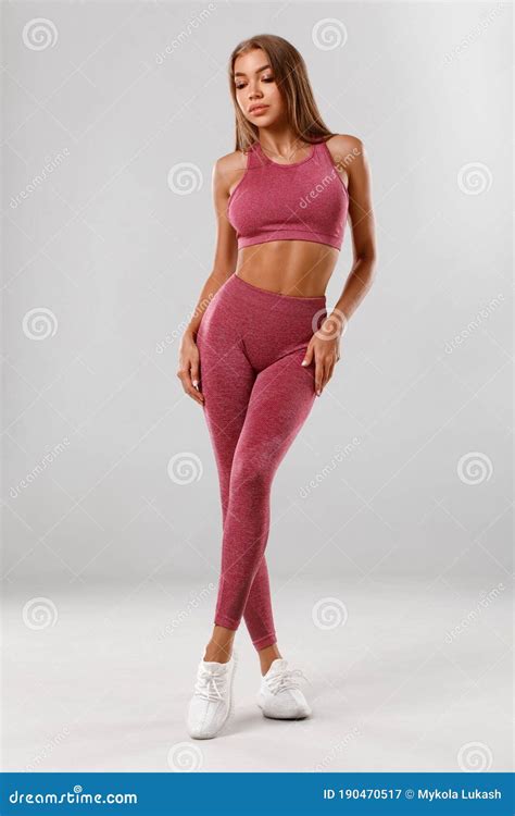 Fitness Woman Beautiful Athletic Girl Isolated On The Gray Background