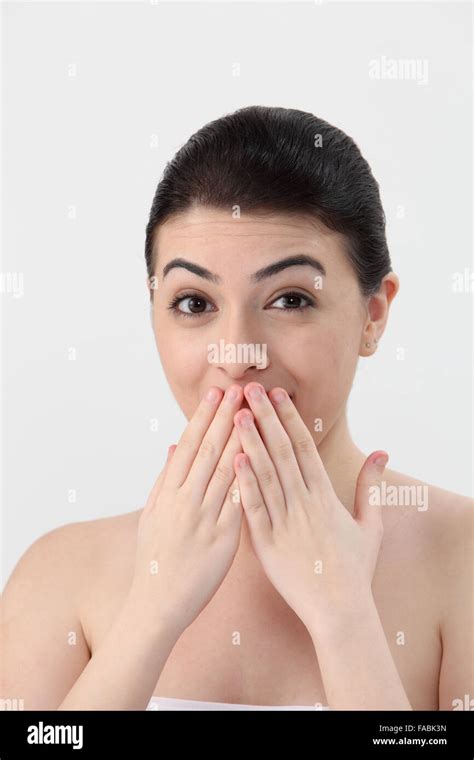 Young Woman With Hand Over Mouth Portrait Stock Photo Alamy
