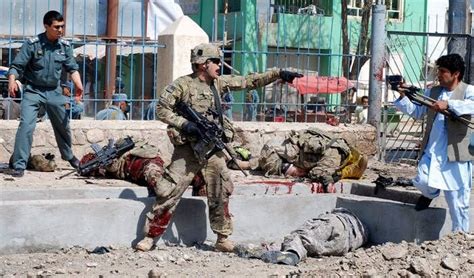 Us Soldier Screaming At A Guy To Stay Away While He Stands Over His