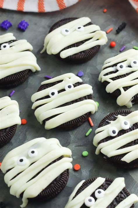 Chocolate cookies with an oreo baked inside are coated with . Halloween Mummy Cookies - BEST Mummy Oreo Cookie Recipe ...