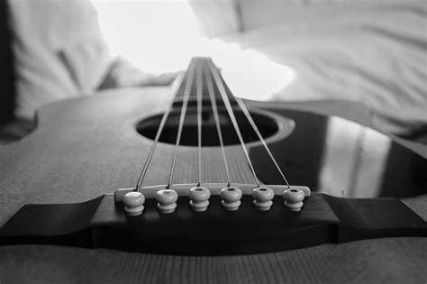 Wooden Acoustic Guitar Macro Photography In Grayscale Photo · Free