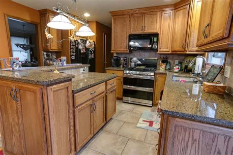How to choose the best wood kitchen cabinets. New countertops and wood cabinets help complete this kitchen make-over | Kitchens by Duncan's ...