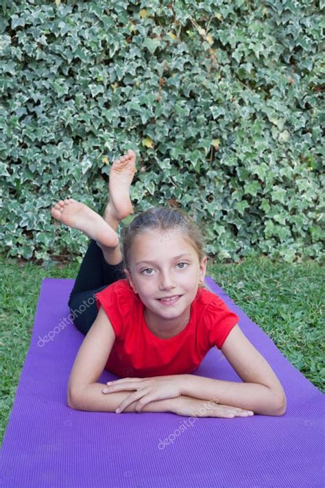 Little girl doing yoga exercise — Stock Photo © leetorrens #183154344