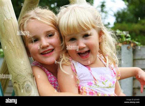 Portrait Photo Blonde Sisters Children Hugging Sitting Blonde Children