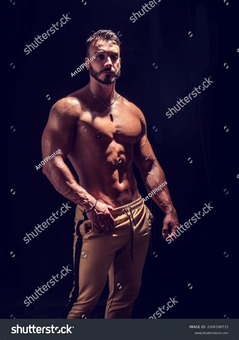 Shirtless Muscular Male Bodybuilder Studio Shot Stock Photo