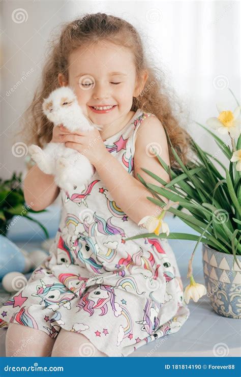 Little Girl Play With Rabbit Indoors In Spring Stock Photo Image Of