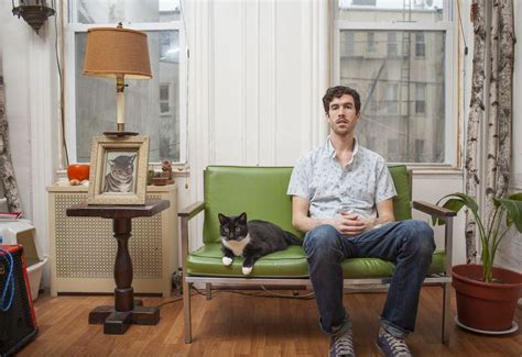 Photo Series Captures Manly Men Posing With Their Adorable Cats
