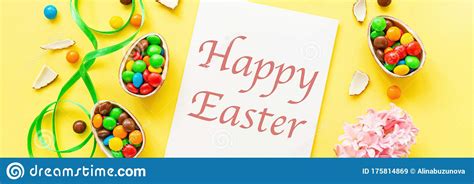 Download Chocolate Easter Eggs And Colorful Candies On Yellow Paper Background. Flat Lay, Copy Space, Top ...