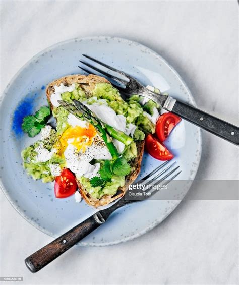Sandwich With Avocado And Poached Eggs High Res Stock Photo Getty Images